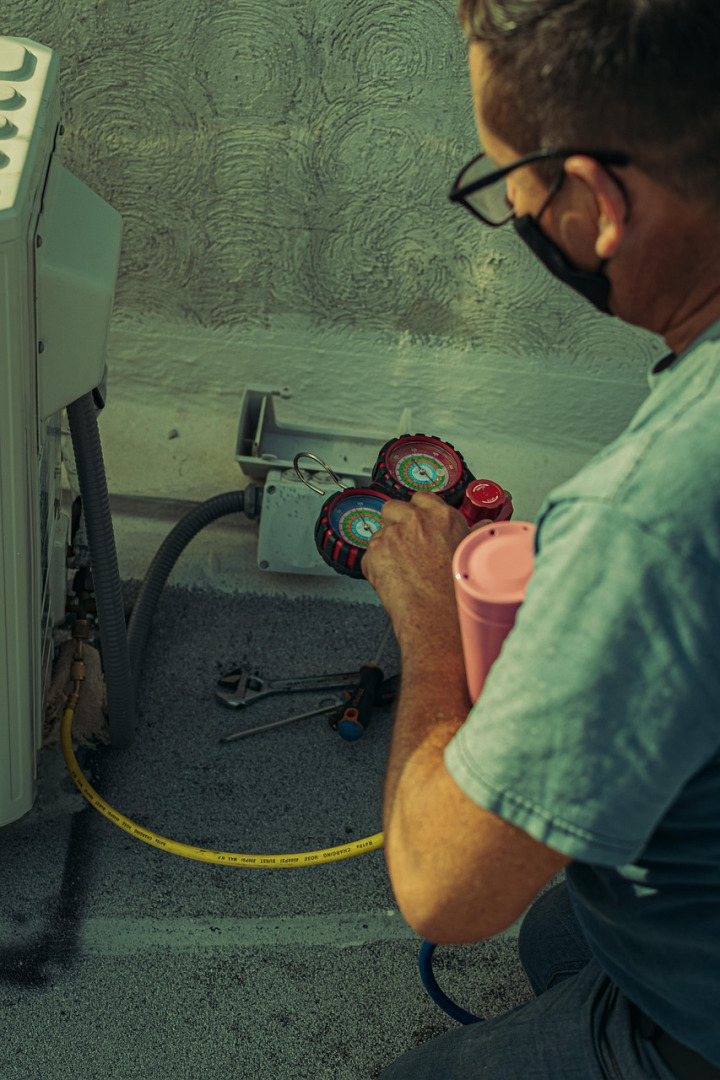 HVAC technician performing maintenance